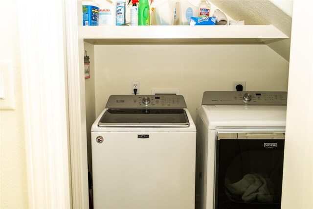 laundry room featuring washing machine and clothes dryer