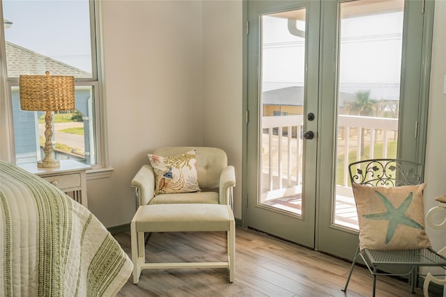 sitting room featuring light wood-style floors and french doors