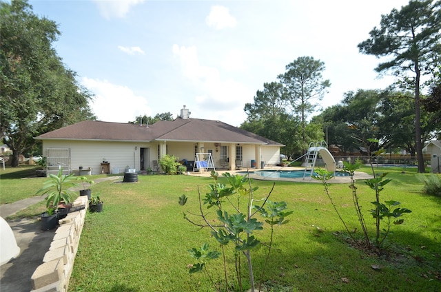 back of house featuring a yard