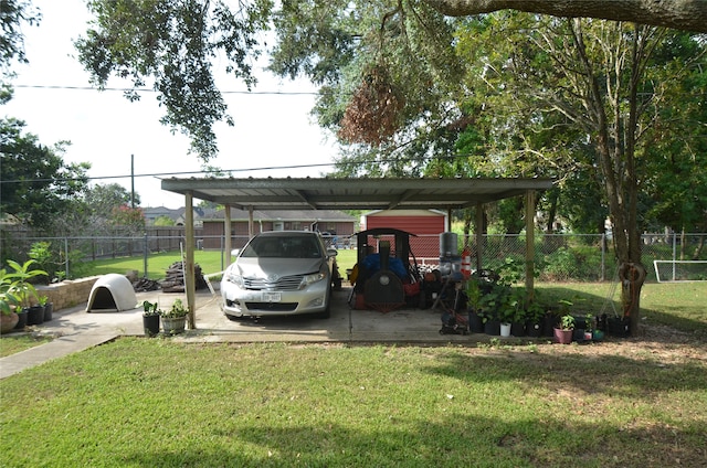 view of parking with a carport and a yard