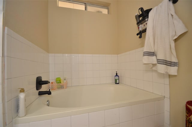 bathroom featuring tiled tub