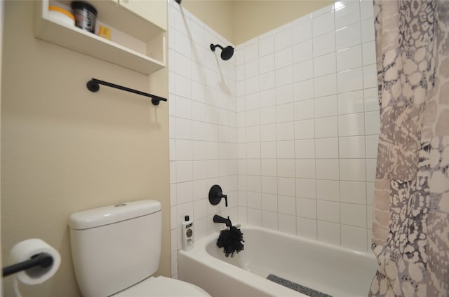 bathroom with shower / bath combo and toilet