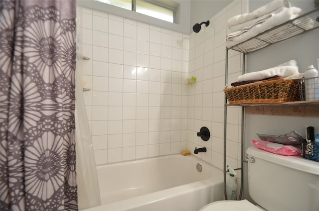 bathroom with shower / tub combo with curtain and toilet