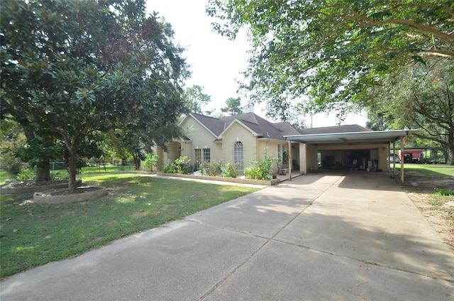 view of front of property featuring a garage, a front lawn, and a carport