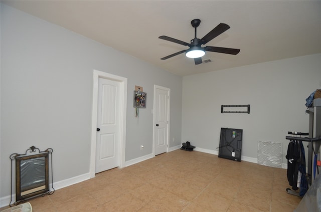 miscellaneous room with ceiling fan and light tile patterned floors