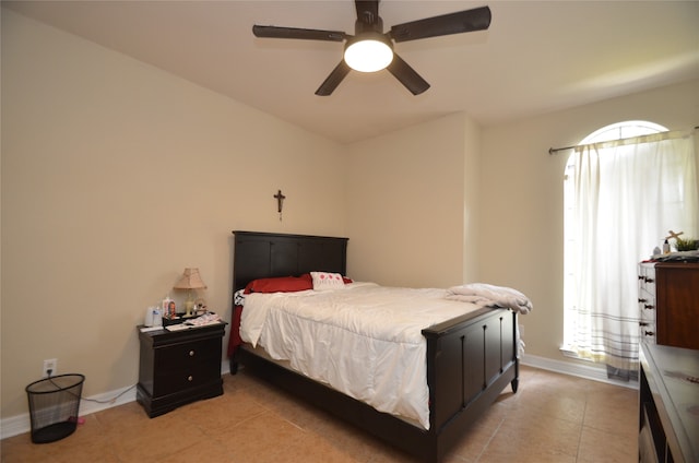 bedroom with light tile patterned floors and ceiling fan