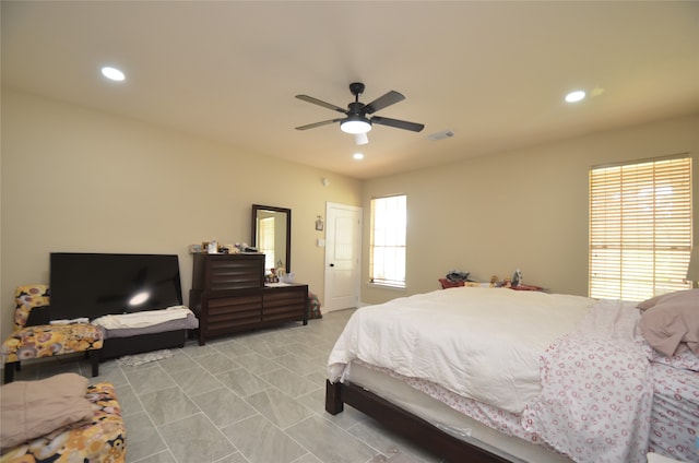 tiled bedroom with ceiling fan