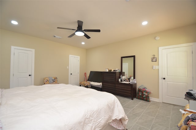 bedroom featuring ceiling fan and light tile patterned floors