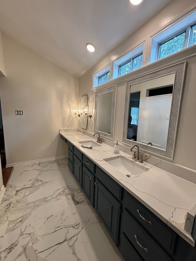 bathroom featuring tile patterned floors and dual vanity