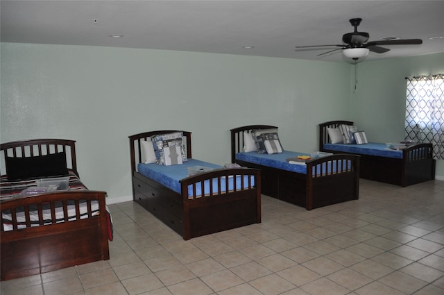 bedroom featuring ceiling fan and light tile patterned floors