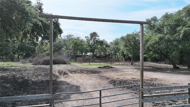 view of yard with a rural view