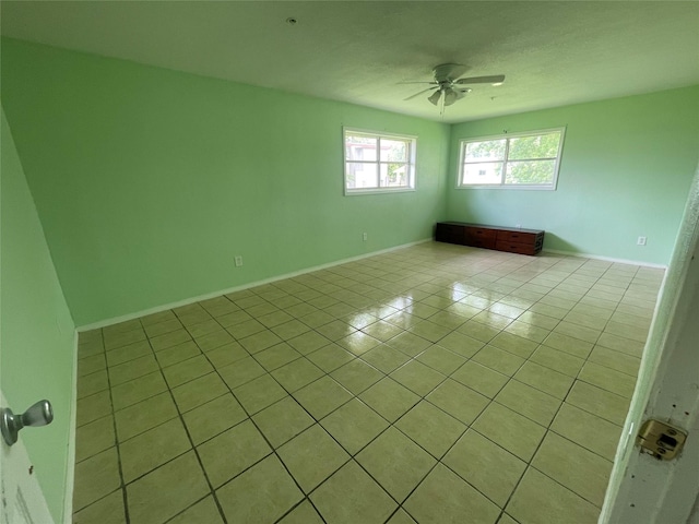 3315 Fm 523rd Rd, Oyster Creek, TX 77541 - unfurnished room featuring light tile patterned floors, ceiling fan, and baseboards