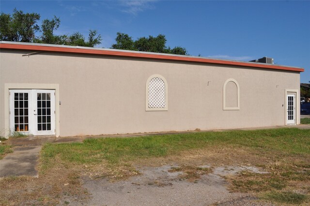 3315 Fm 523rd Rd, Oyster Creek, TX 77541 - view of home's exterior featuring french doors and stucco siding