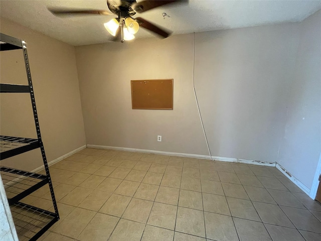 3315 Fm 523rd Rd, Oyster Creek, TX 77541 - unfurnished room featuring a textured ceiling, a ceiling fan, tile patterned flooring, and baseboards