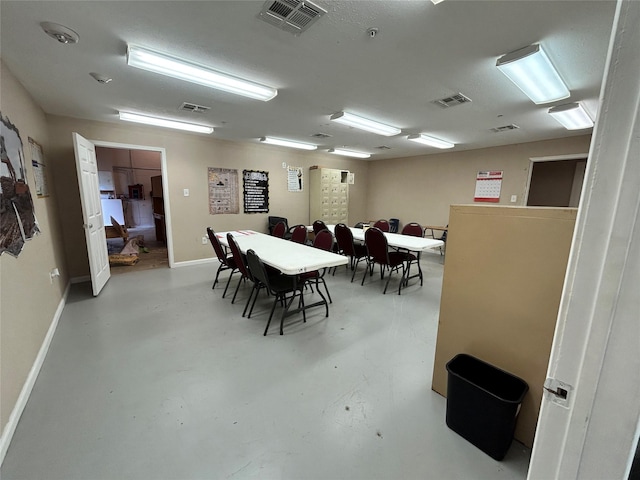 3315 Fm 523rd Rd, Oyster Creek, TX 77541 - dining room with concrete floors, visible vents, and baseboards