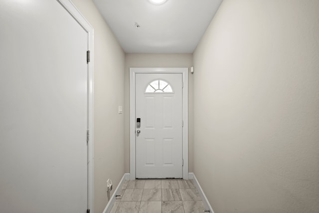 doorway featuring light tile patterned flooring