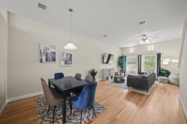 dining area featuring ceiling fan and light wood-type flooring