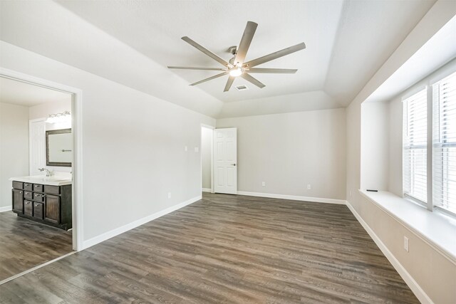 spare room with sink, ceiling fan, and dark hardwood / wood-style floors