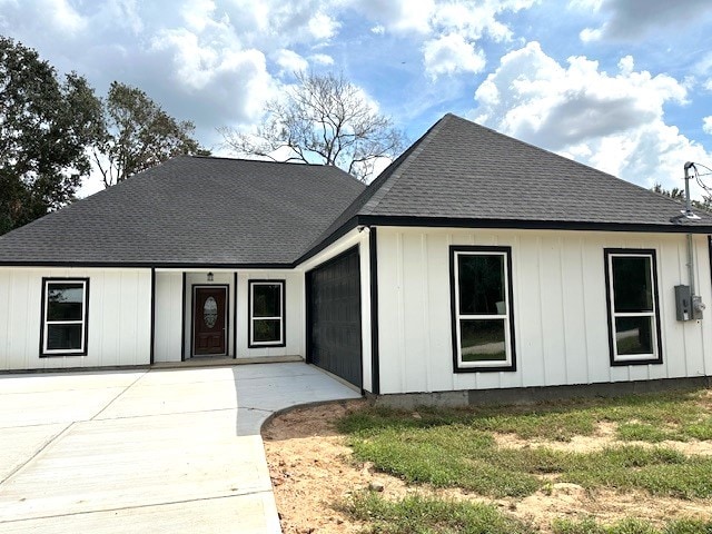 24629 Waterford St, Hempstead, TX 77445 - modern farmhouse style home with roof with shingles and board and batten siding