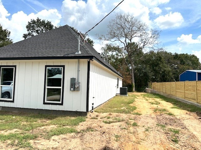 view of side of home featuring central air condition unit