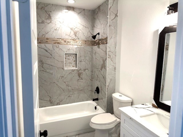 24629 Waterford St, Hempstead, TX 77445 - full bathroom with vanity, shower / tub combination, marble finish floor, and toilet