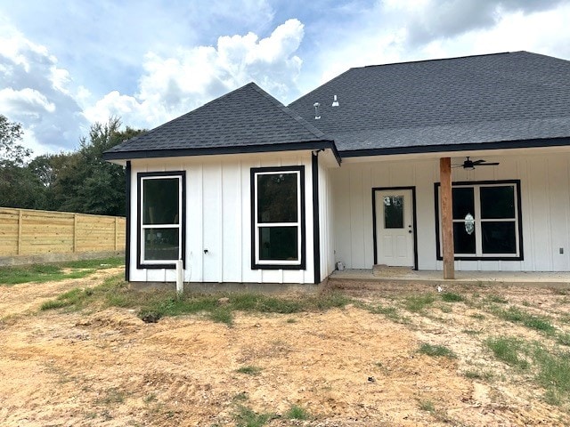 rear view of property featuring ceiling fan