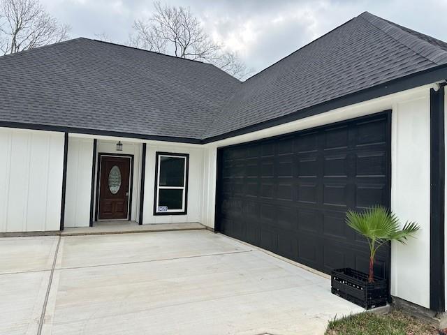 24629 Waterford St, Hempstead, TX 77445 - view of front facade featuring a shingled roof, a garage, and driveway