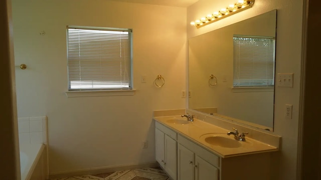 bathroom featuring double sink vanity, tile patterned flooring, and a tub to relax in