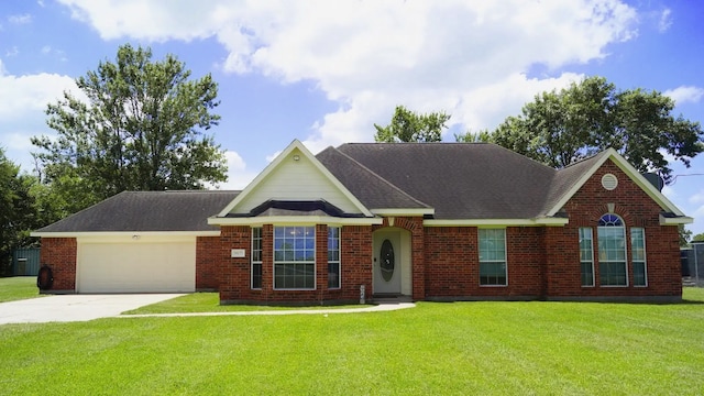 view of front of property featuring a garage and a front yard