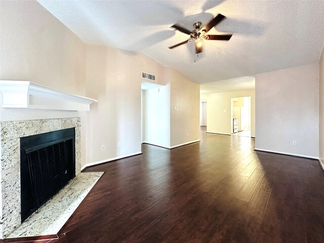 unfurnished living room with hardwood / wood-style flooring, a fireplace, a textured ceiling, and ceiling fan