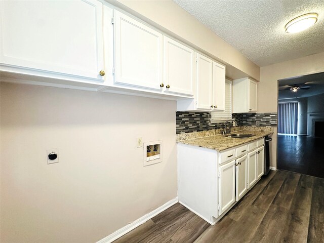 kitchen with backsplash, dark hardwood / wood-style flooring, dishwasher, ceiling fan, and white cabinets