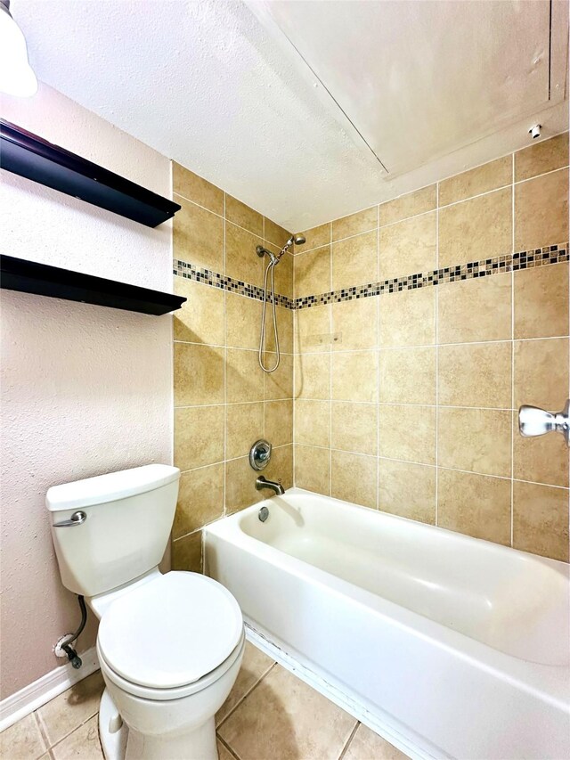 bathroom with shower / bath combination, baseboards, toilet, tile patterned flooring, and a textured ceiling