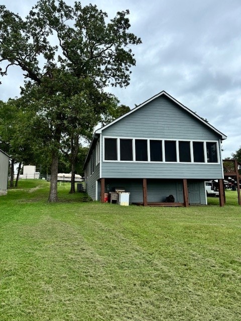 view of home's exterior featuring a lawn