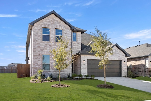 view of front of property featuring a garage and a front lawn