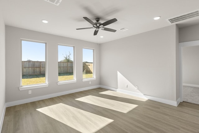 spare room featuring ceiling fan and wood-type flooring