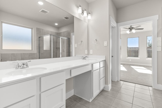 bathroom featuring ceiling fan, tile patterned flooring, vanity, and a shower with shower door