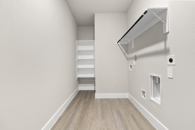 laundry room featuring hookup for an electric dryer, hookup for a gas dryer, hookup for a washing machine, and light hardwood / wood-style flooring