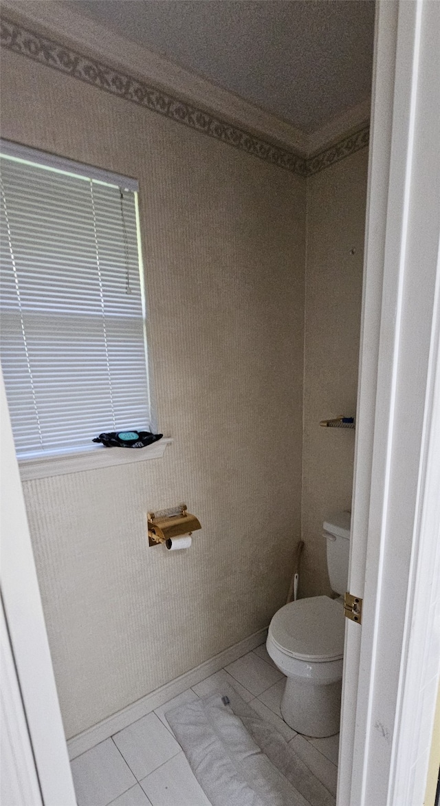 bathroom featuring toilet and tile patterned floors