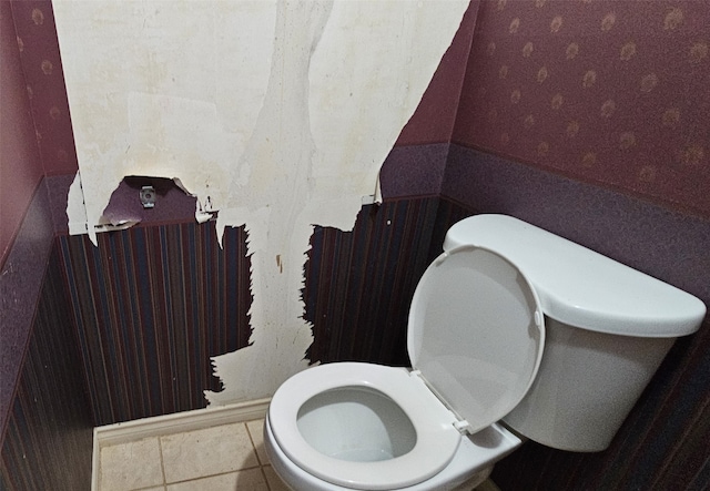 bathroom featuring toilet and tile patterned floors