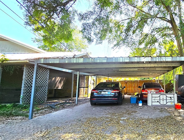 view of vehicle parking featuring a carport