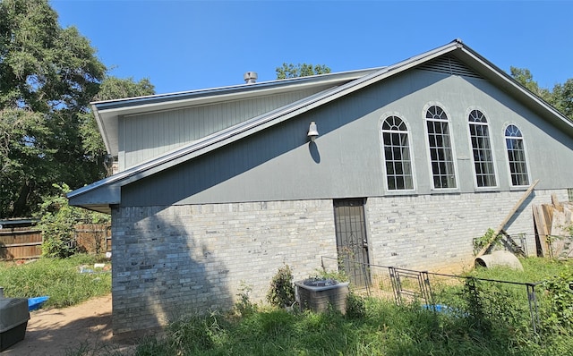 view of side of home with cooling unit