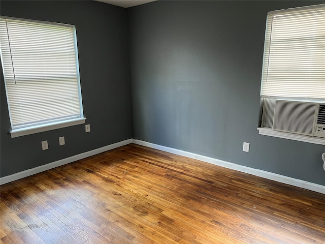 empty room featuring hardwood / wood-style floors and a healthy amount of sunlight