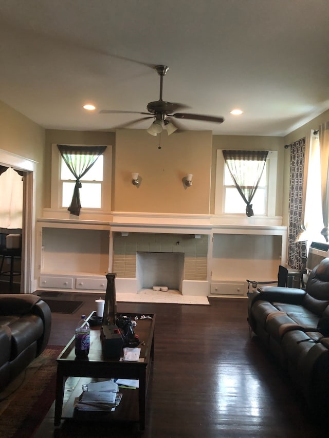 living room with ceiling fan, plenty of natural light, and hardwood / wood-style floors