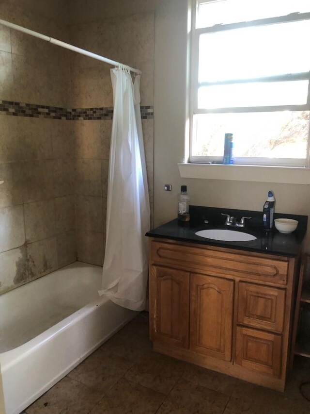 bathroom with shower / bath combination with curtain, tile patterned flooring, and vanity