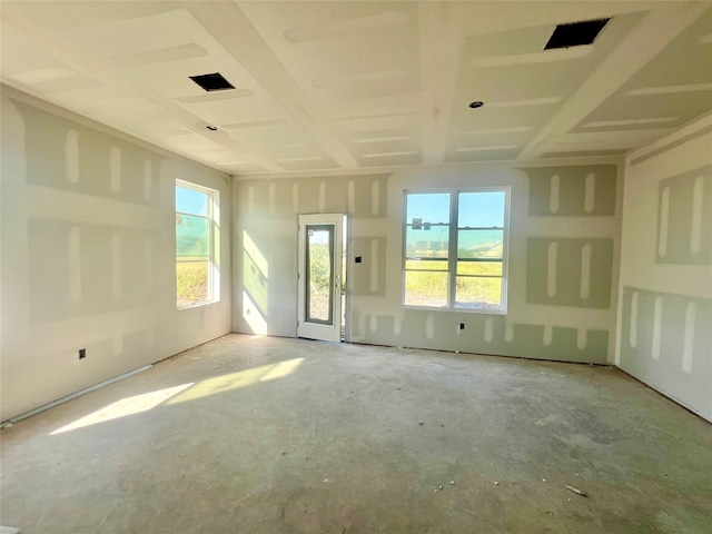 spare room featuring concrete flooring