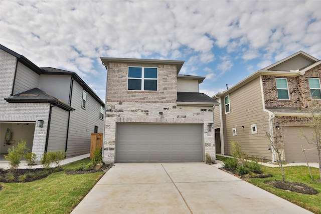 front of property with a front yard and a garage