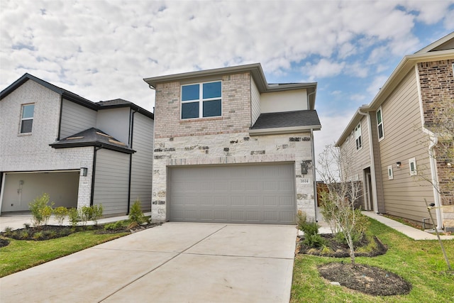 view of front of house featuring a front yard and a garage