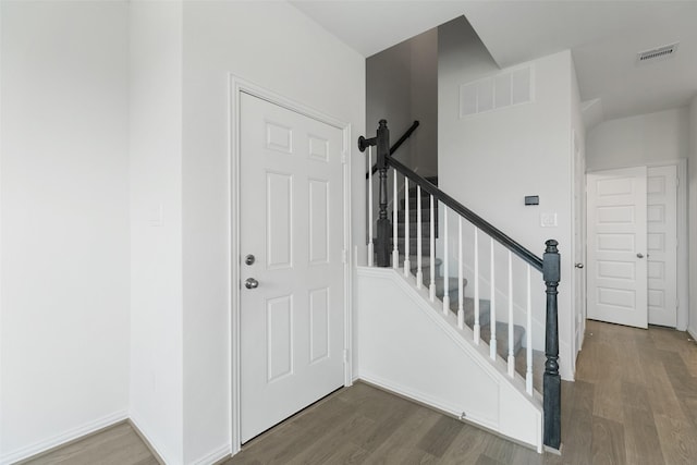 stairway with wood-type flooring