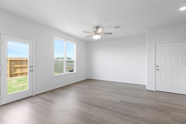 interior space with ceiling fan, light hardwood / wood-style floors, and a healthy amount of sunlight