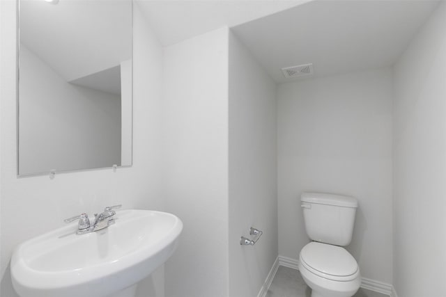 bathroom featuring sink and toilet